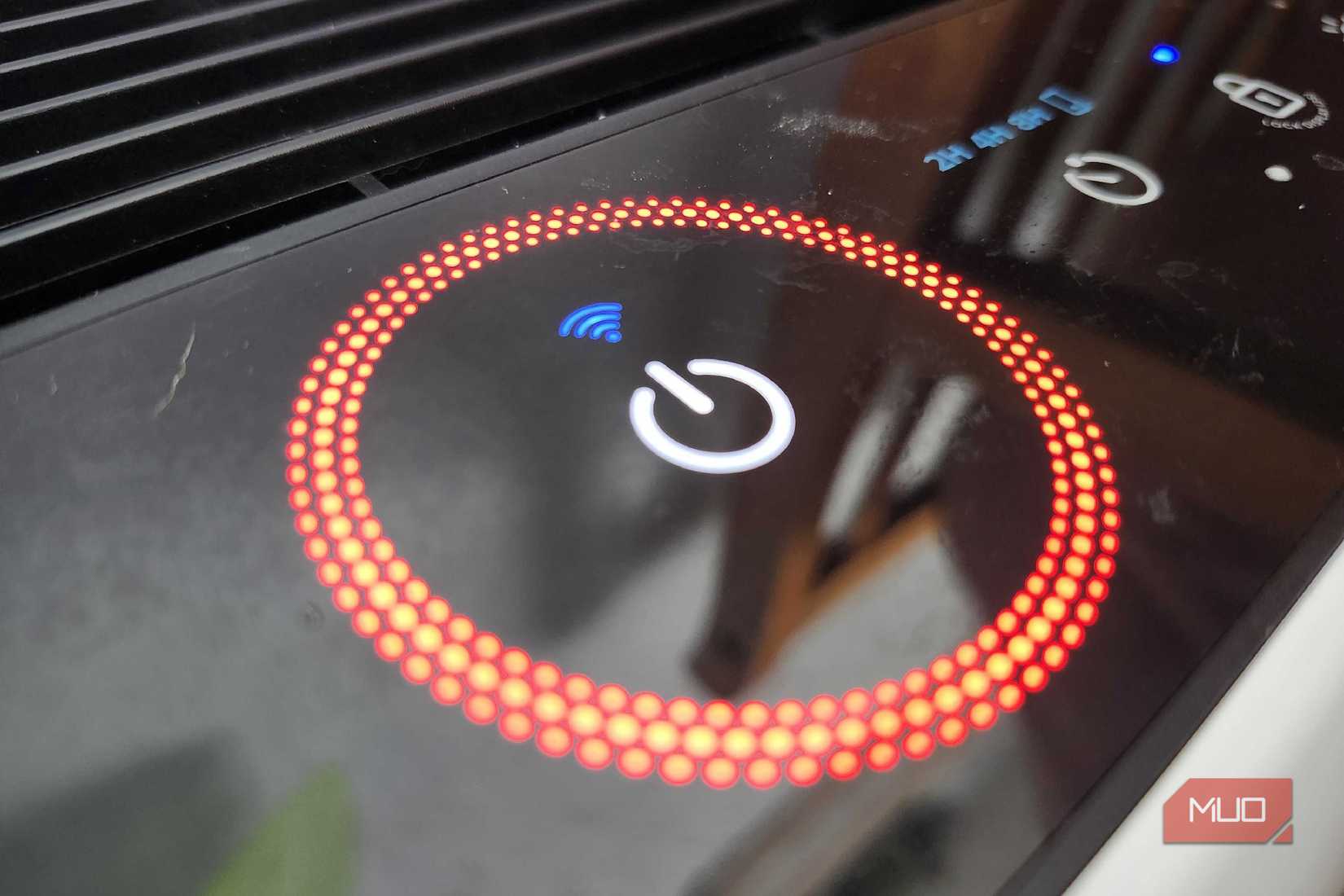The power button shining red to detail bad air quality on the LeVoit Air Purifier