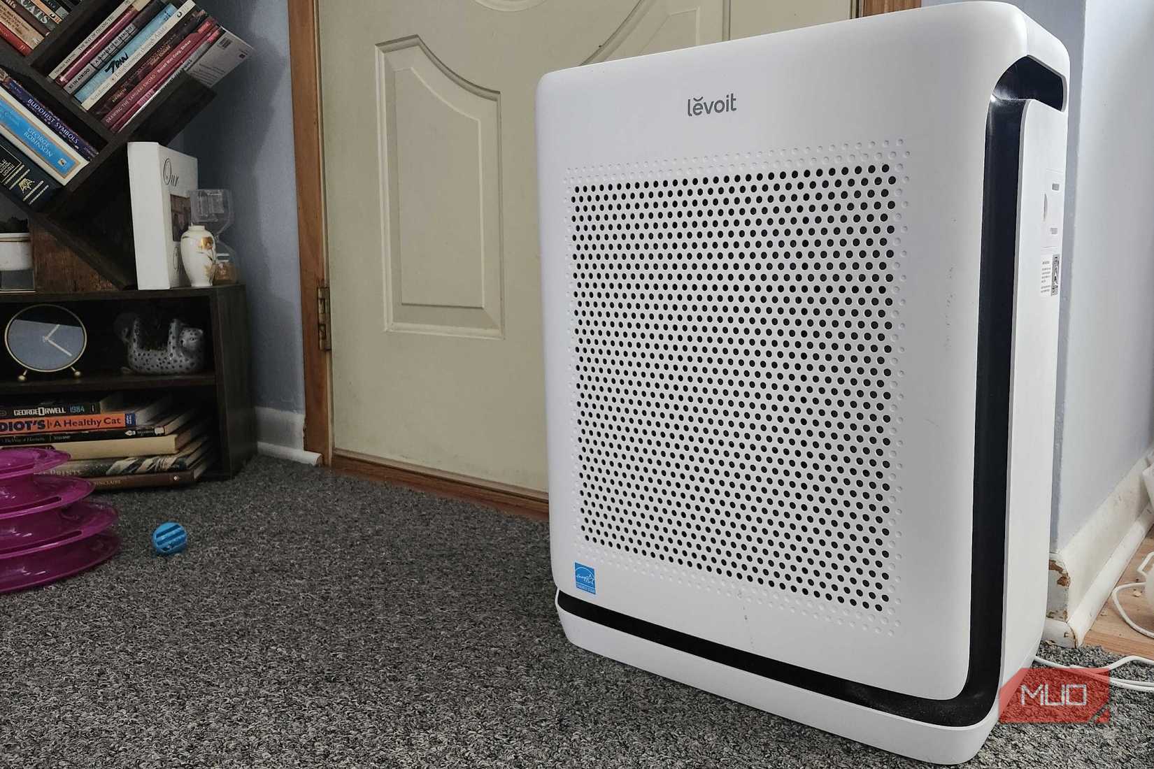 The LeVoit Vital 200S-P air purifier in front of a door