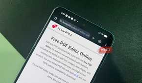 Phone with browser open displaying I Love PDF 2