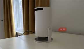 A Magcubic Auto Keystone Mini Portable Projector on a dresser