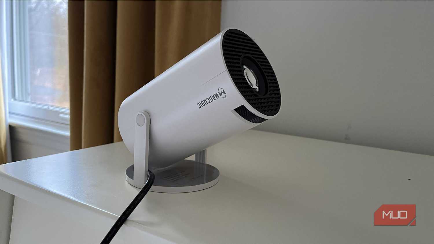 A Magcubic Auto Keystone Mini Portable Projector tilted