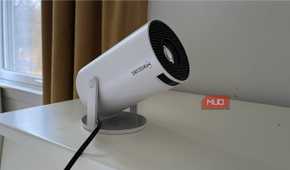 A Magcubic Auto Keystone Mini Portable Projector tilted