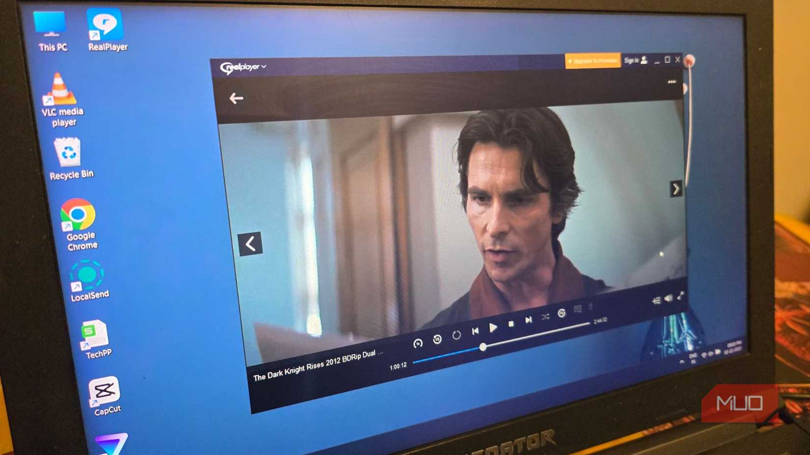 RealPlayer playing the movie The Dark Knight Rises on a Windows laptop