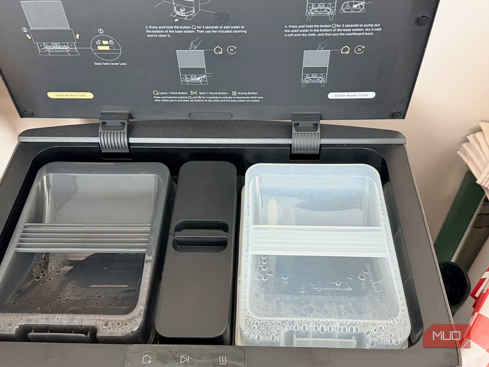 The top of robot vacuum base opened.