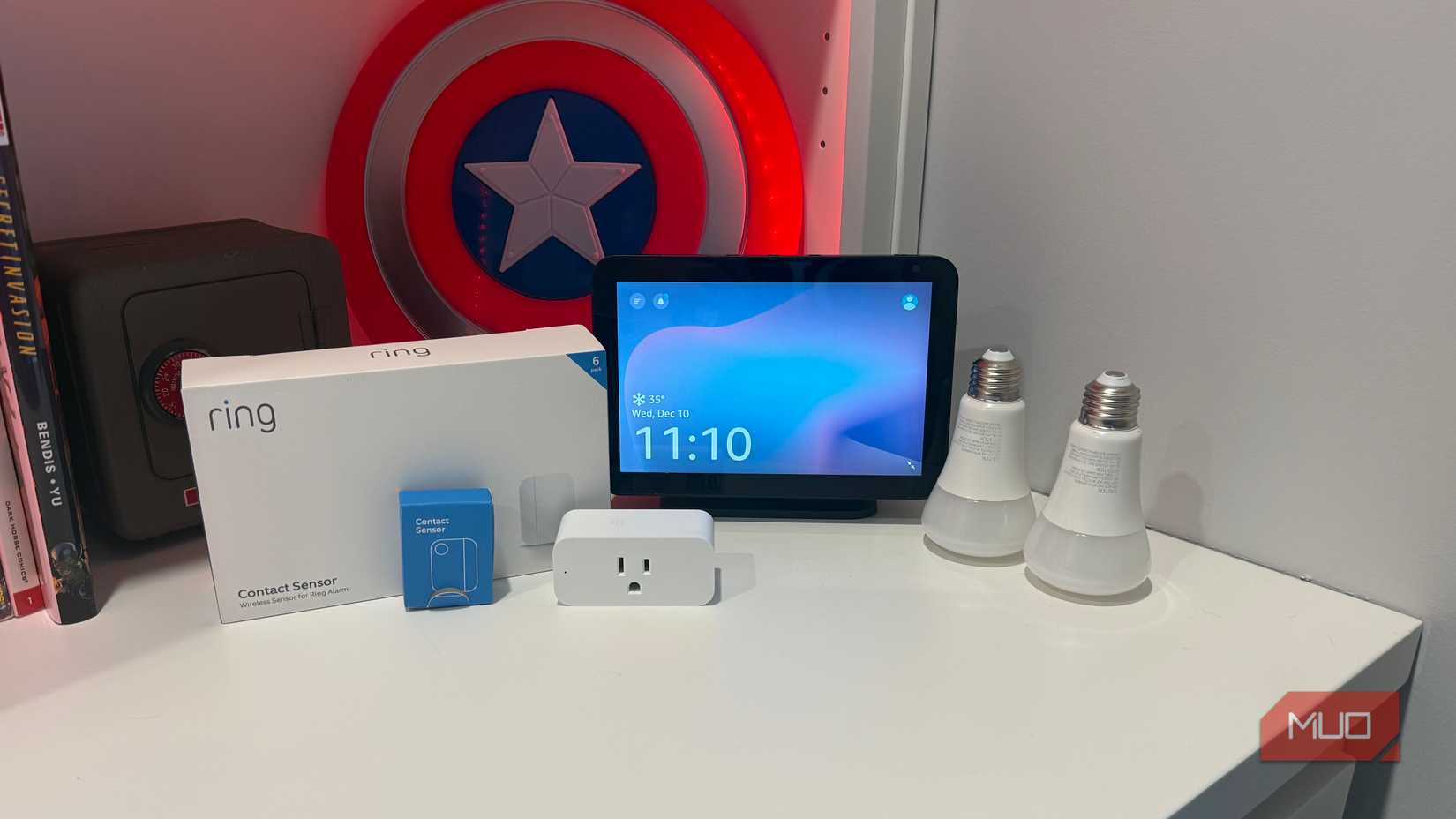 several smart home gadgets on desk with echo show 8