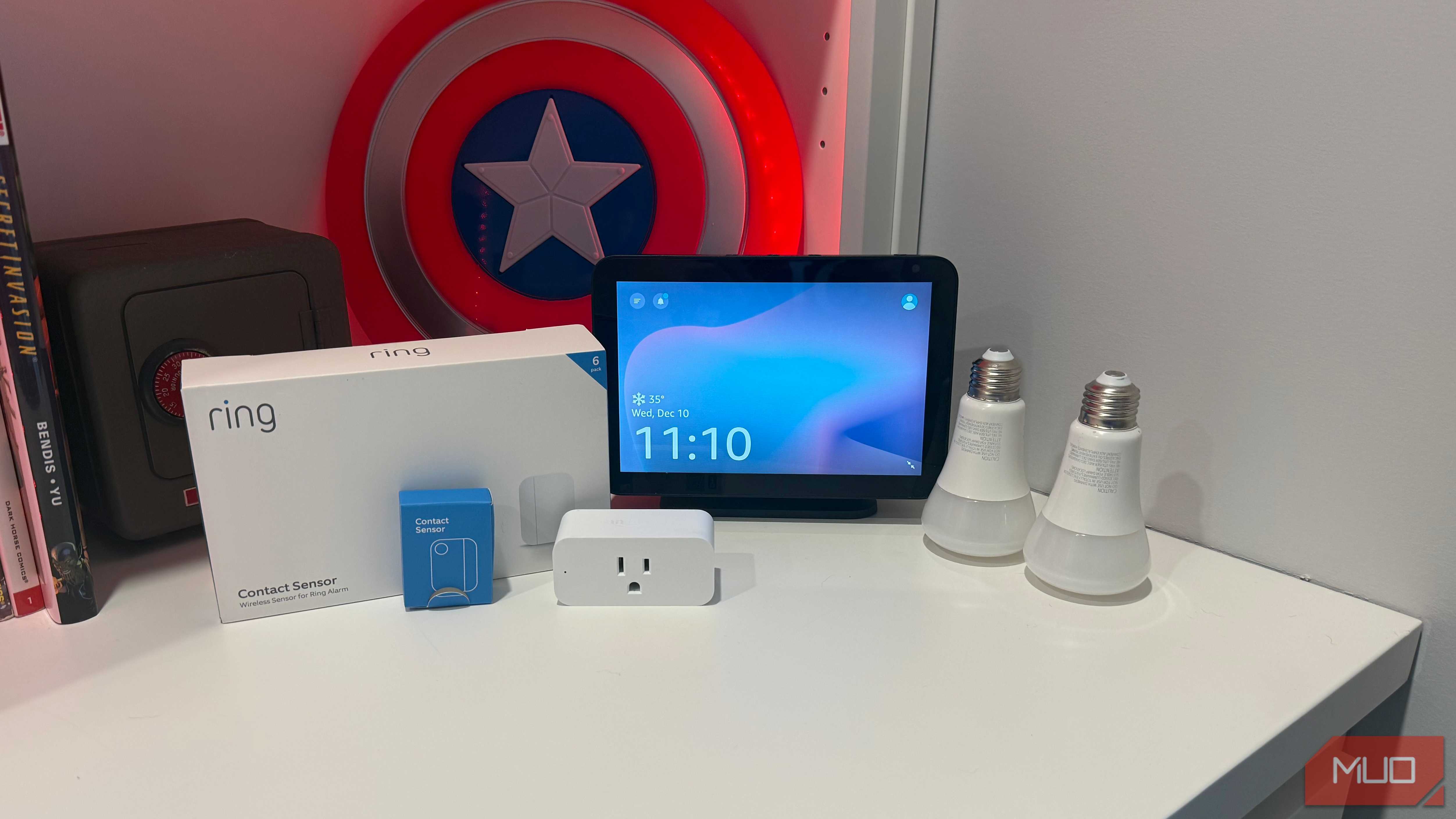 several smart home gadgets on desk with echo show 8
