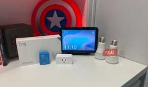 several smart home gadgets on desk with echo show 8