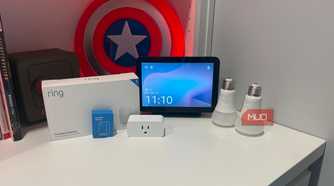 several smart home gadgets on desk with echo show 8