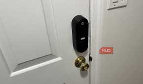 A Yale Smart Lock with a traditional doorknob