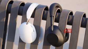 The Sonos Ace and Sony WH-1000XM6 on a park bench.