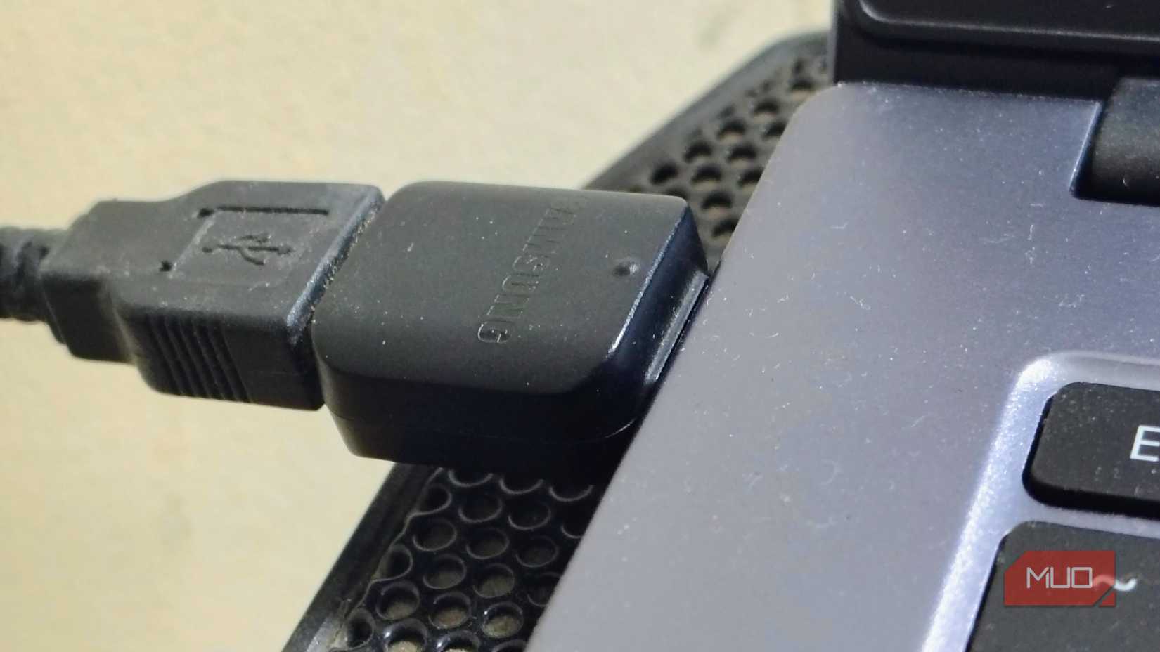 An old USB keyboard plugged in a Type-C port in Windows laptop using adapter,