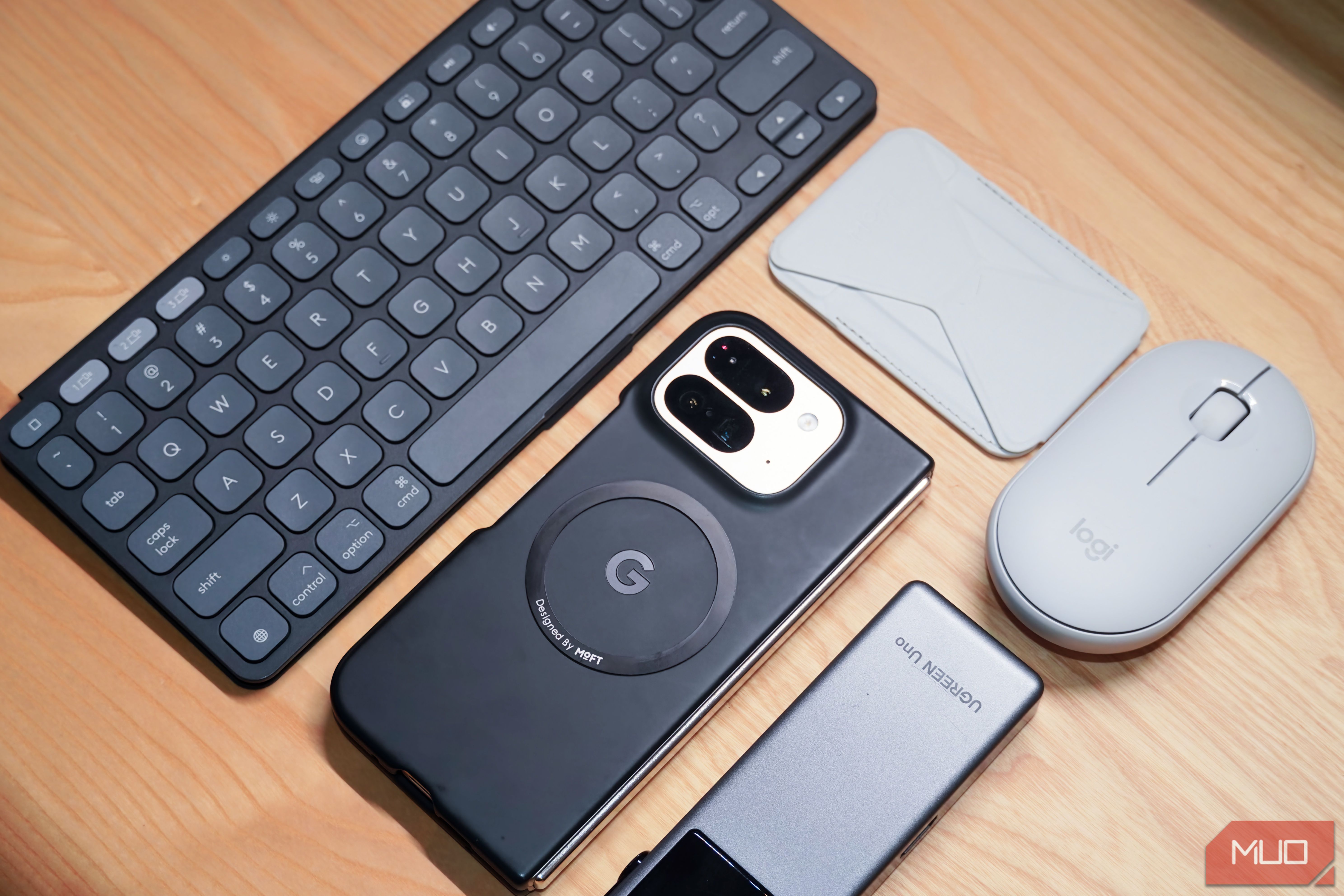 A collection of accessories surrounding a Google Pixel 9 Pro Fold.