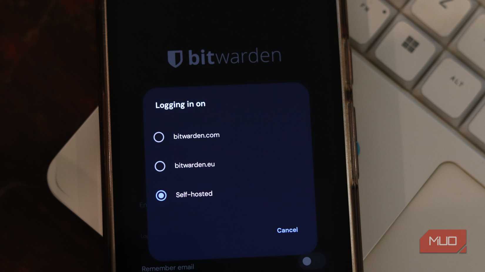 Bitwarden app showing self-hosted option.