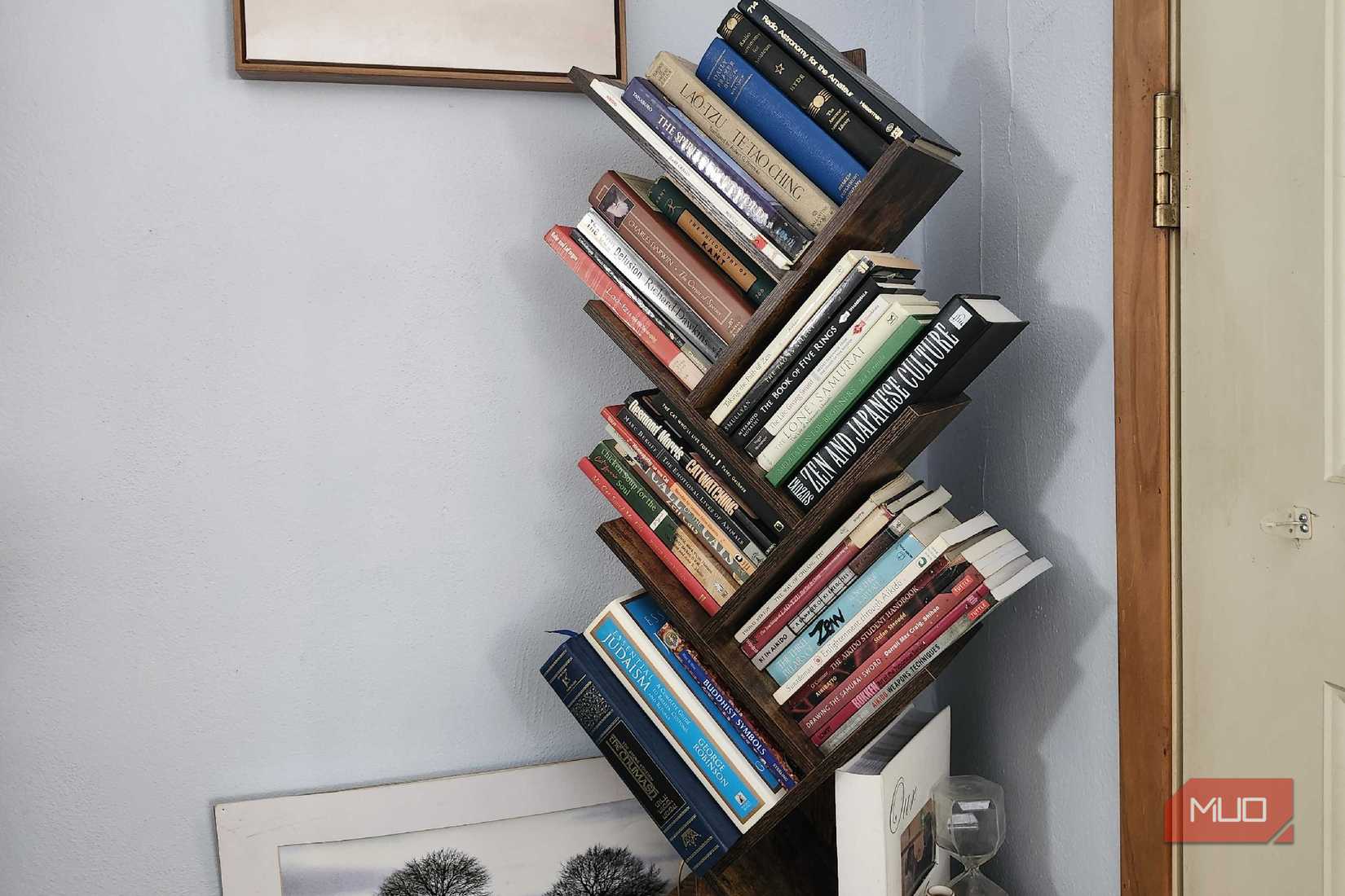 Bookshelf in home, filled with a variety of different books