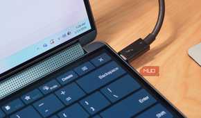 Using a thunderbolt cable to connect a laptop to accessories.