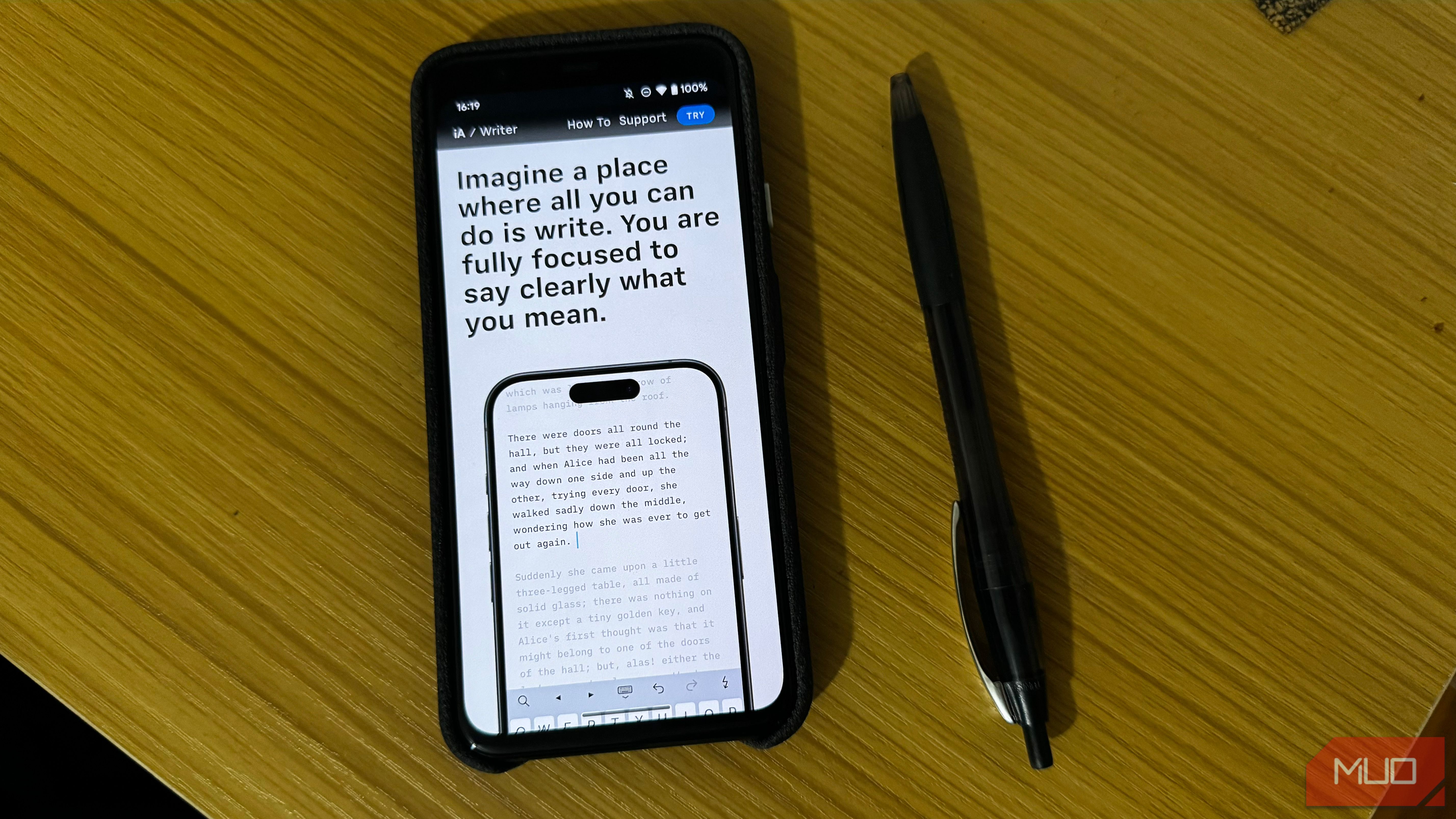 iA Writer Website Shown on iPhone Next to a Pen