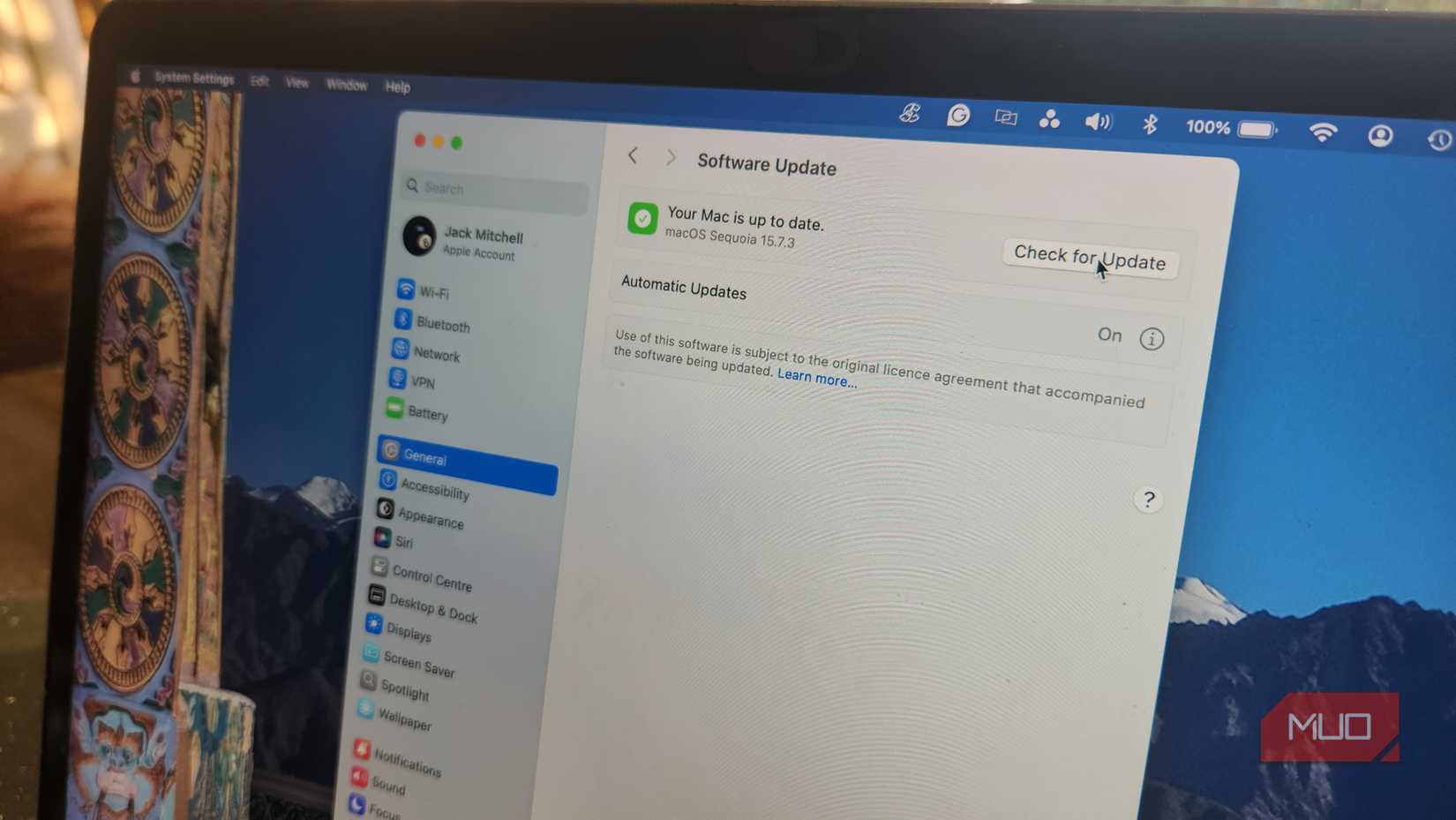 macOS update window showing "Updated" status.