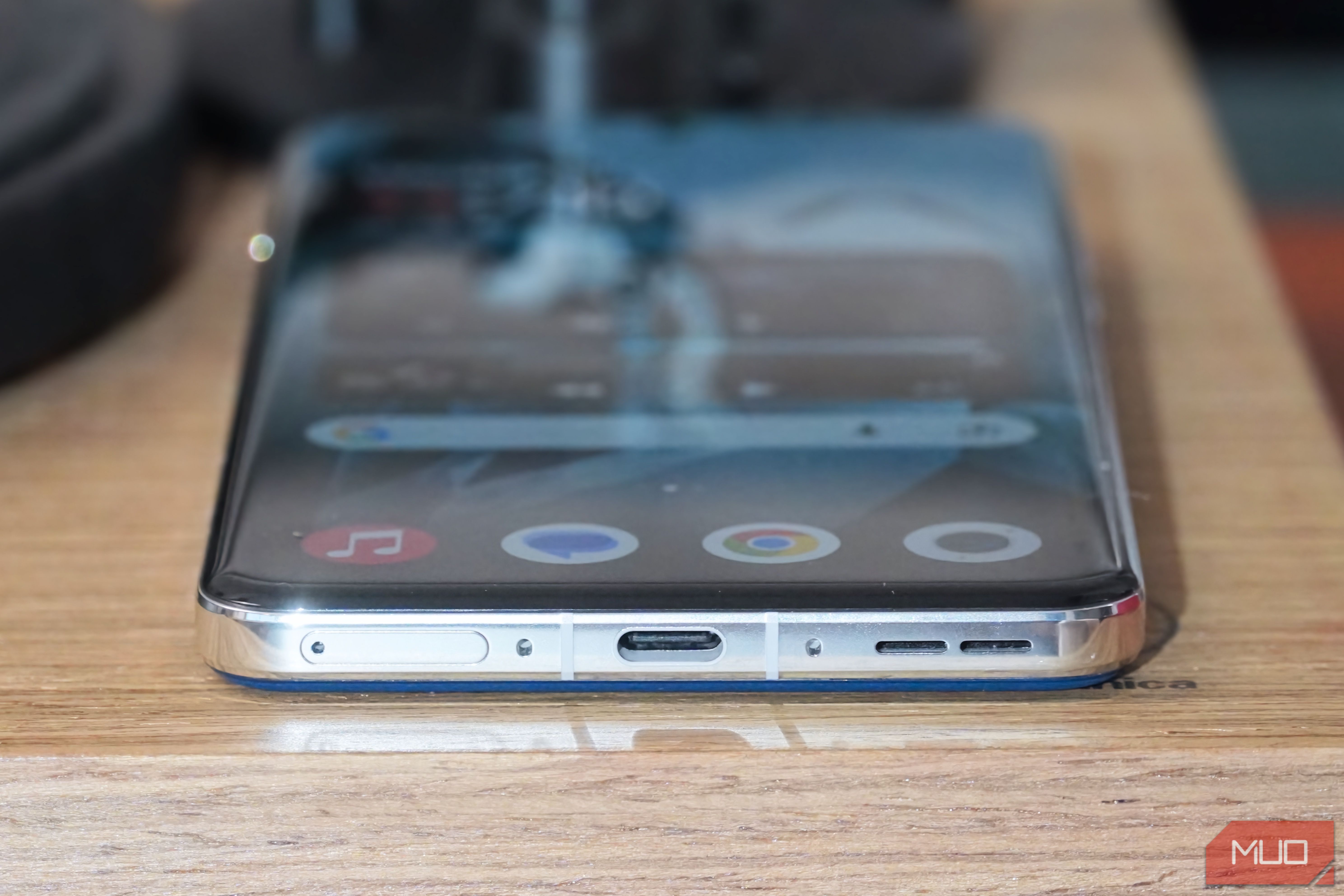 The OnePlus 13 USB-C port and SIM tray.