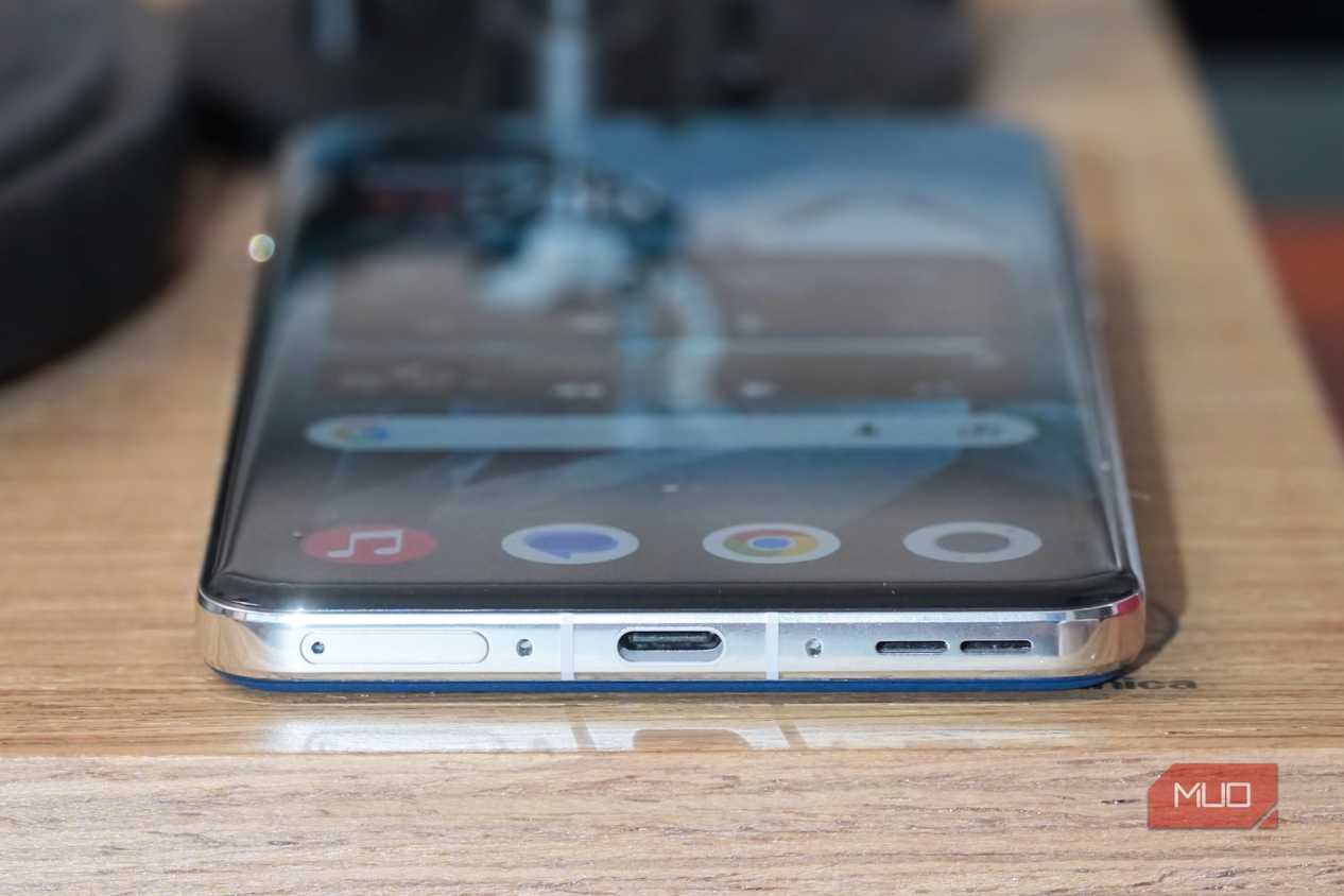 The OnePlus 13 USB-C port and SIM tray.