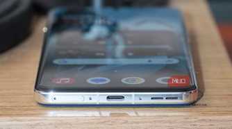 The OnePlus 13 USB-C port and SIM tray.