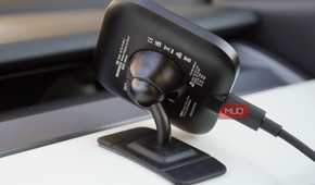 The ballhead mount of a Peak Design Qi2 car charger.