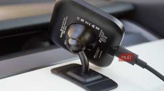 The ballhead mount of a Peak Design Qi2 car charger.