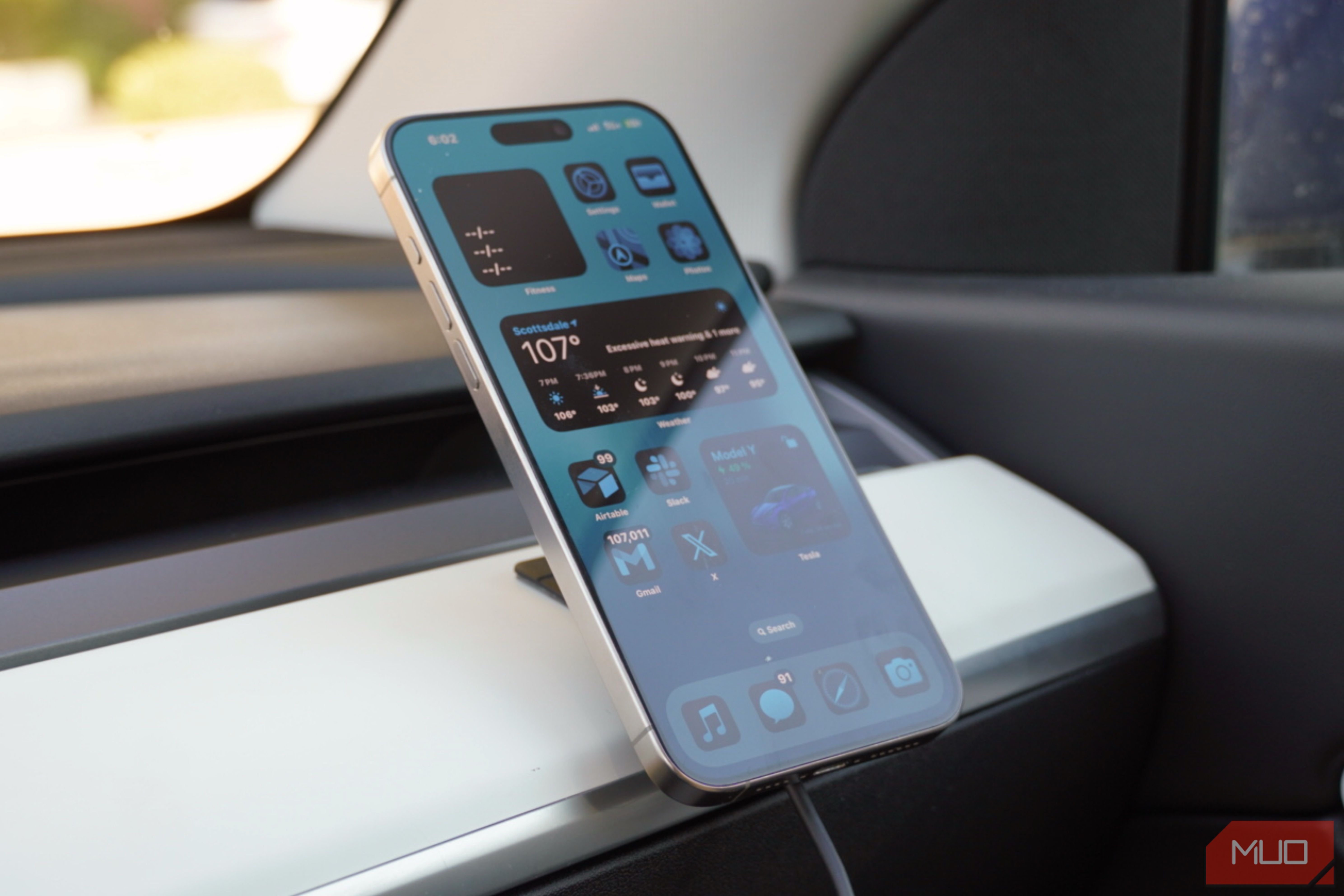 An iPhone 15 Pro Max on a Peak Design Qi2 car charging mount.