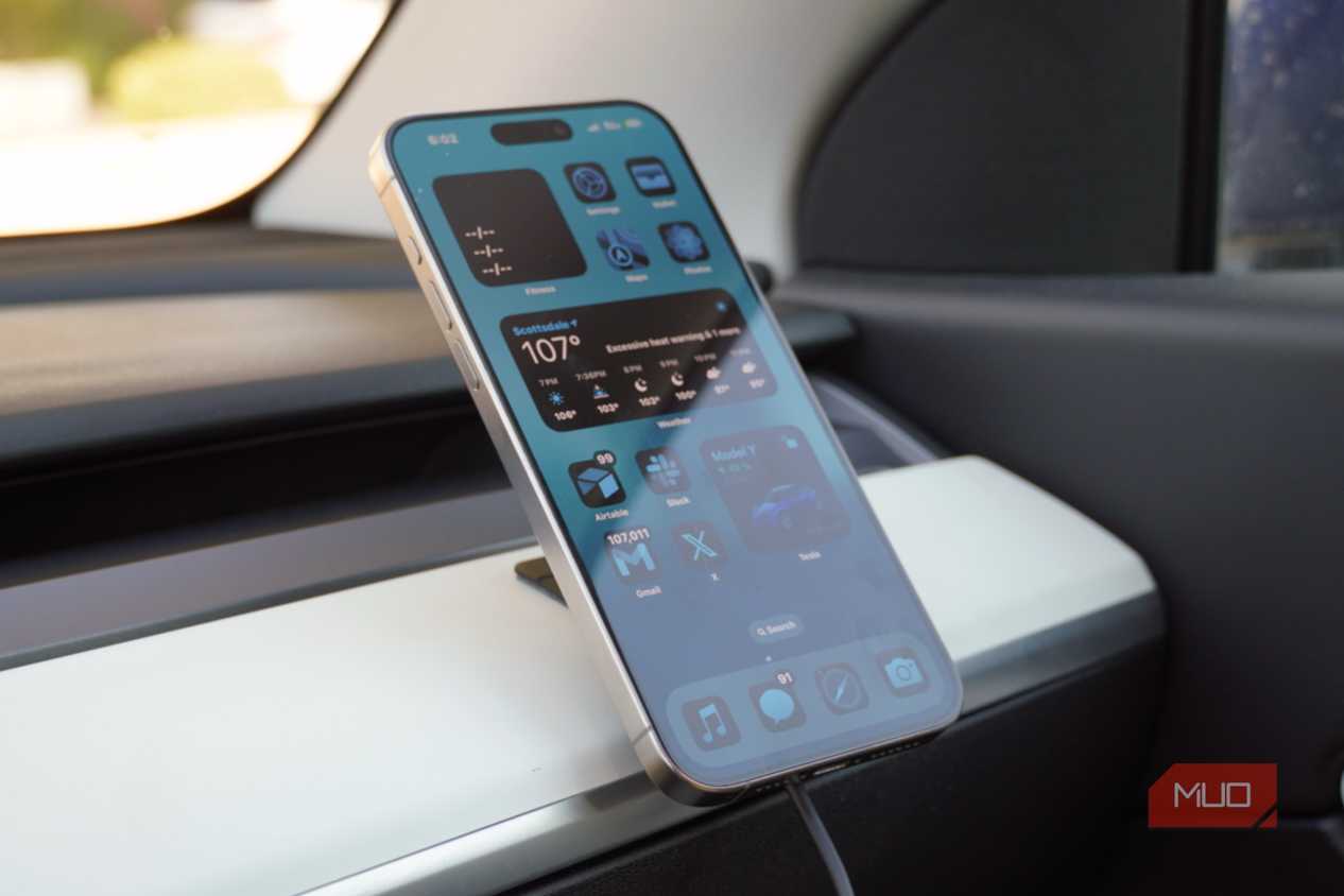 An iPhone 15 Pro Max on a Peak Design Qi2 car charging mount.