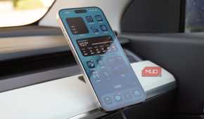 An iPhone 15 Pro Max on a Peak Design Qi2 car charging mount.