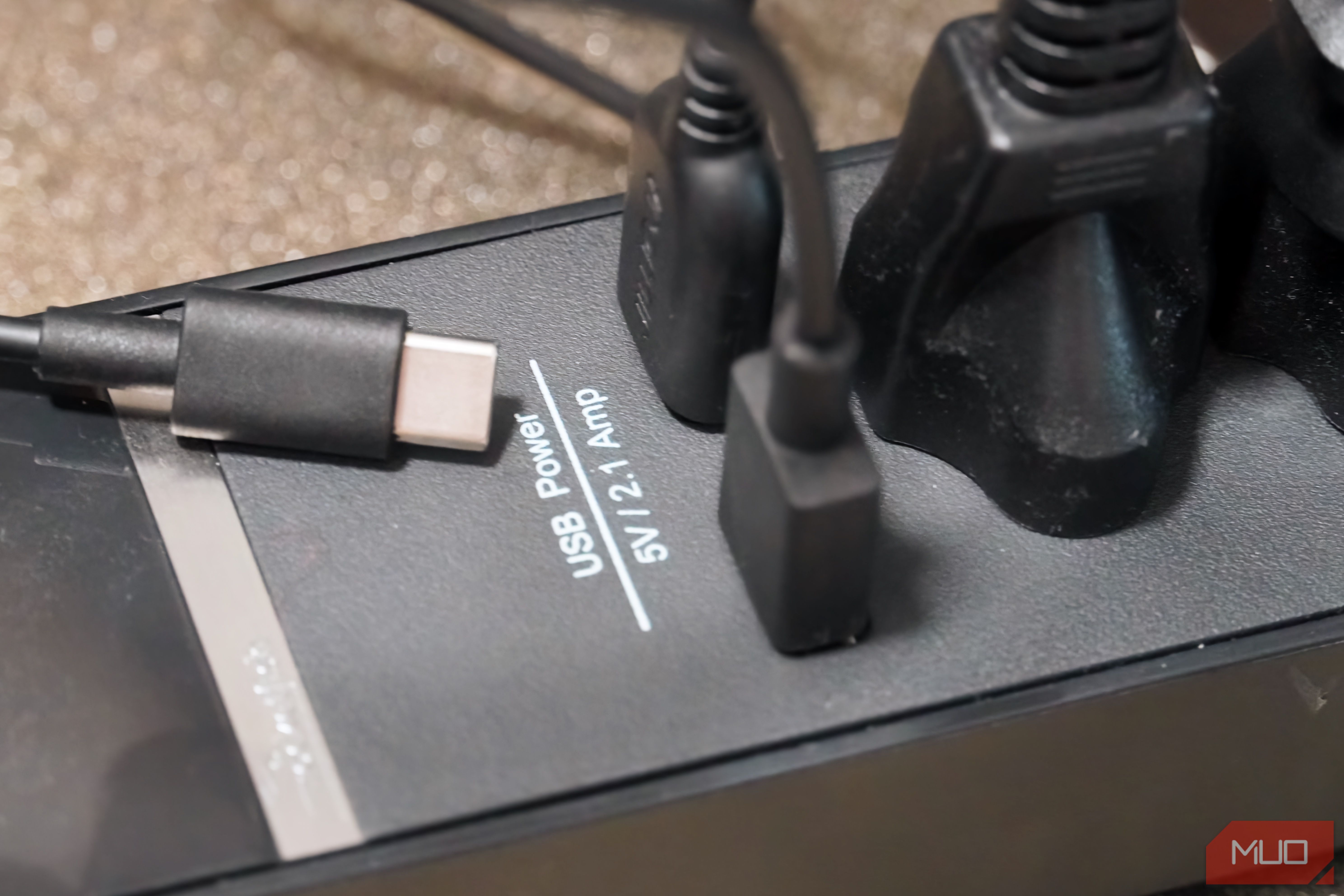 The USB cables plugged into a power strip.