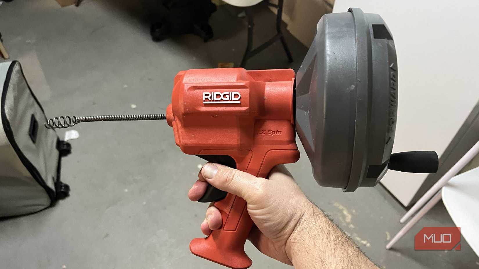 A Ridgid drain snake in a basement