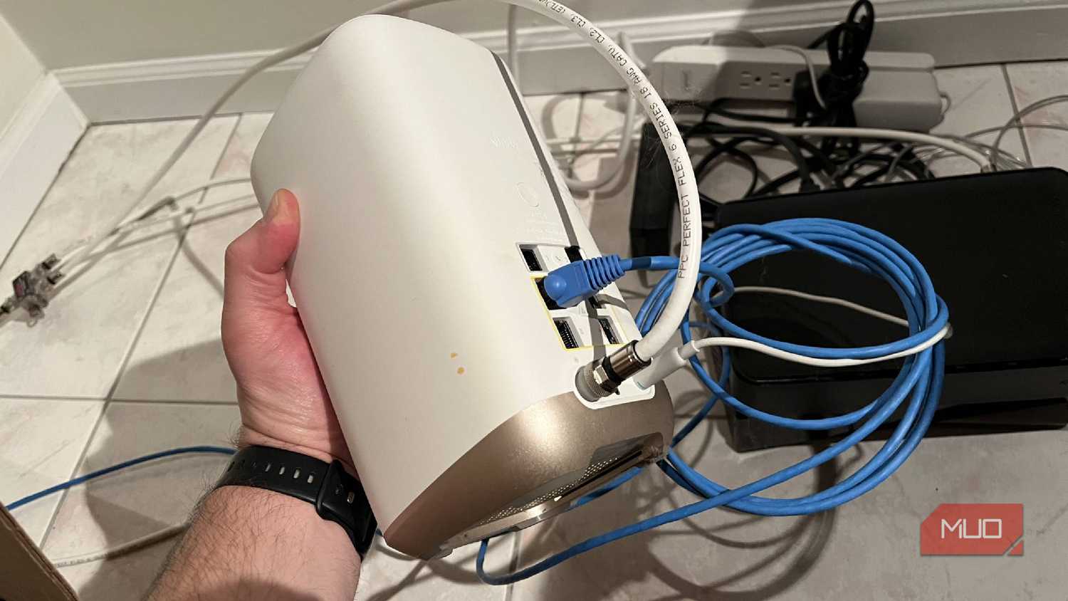 A Wi-Fi router being held