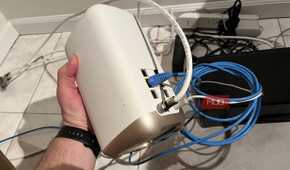 A Wi-Fi router being held