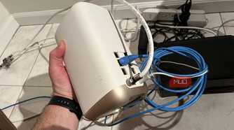 A Wi-Fi router being held