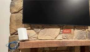 A Wi-Fi router on a mantle