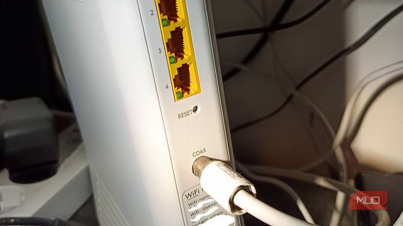 A router with built in cable modem showing the coaxial cable connection