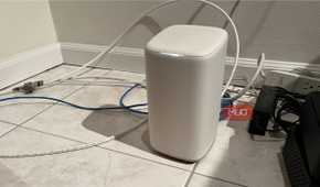 A Wi-Fi router on a tile floor