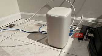 A Wi-Fi router on a tile floor