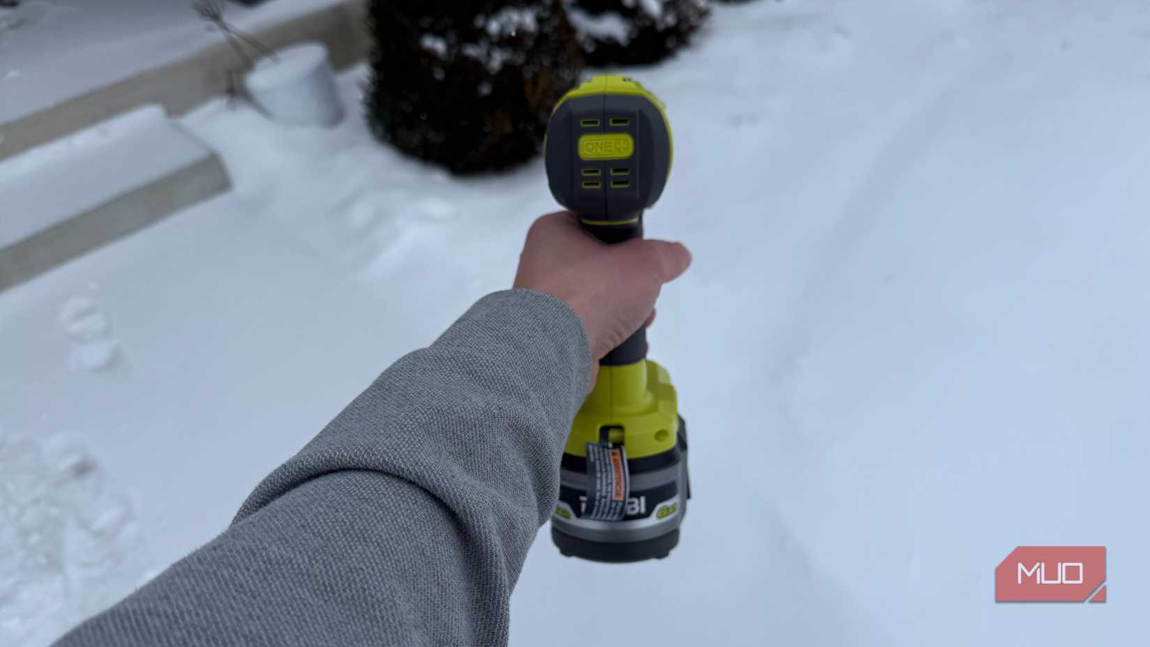 ryobi heat gun back side in hand with snow