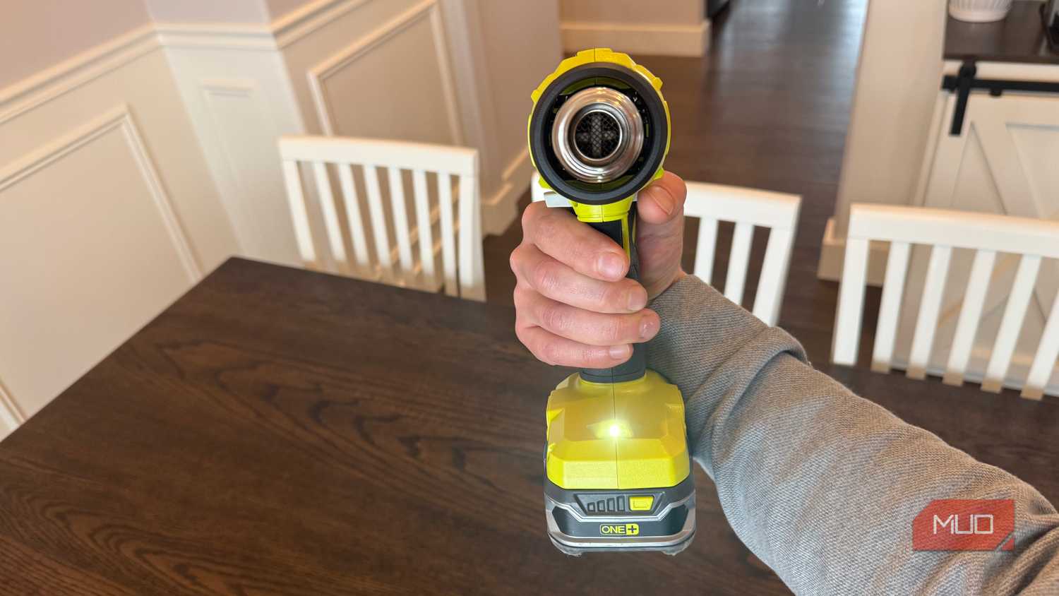 ryobi heat gun in hand with trigger depressed