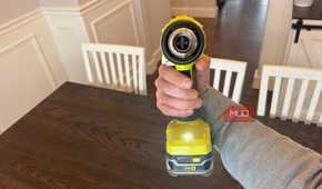 ryobi heat gun in hand with trigger depressed