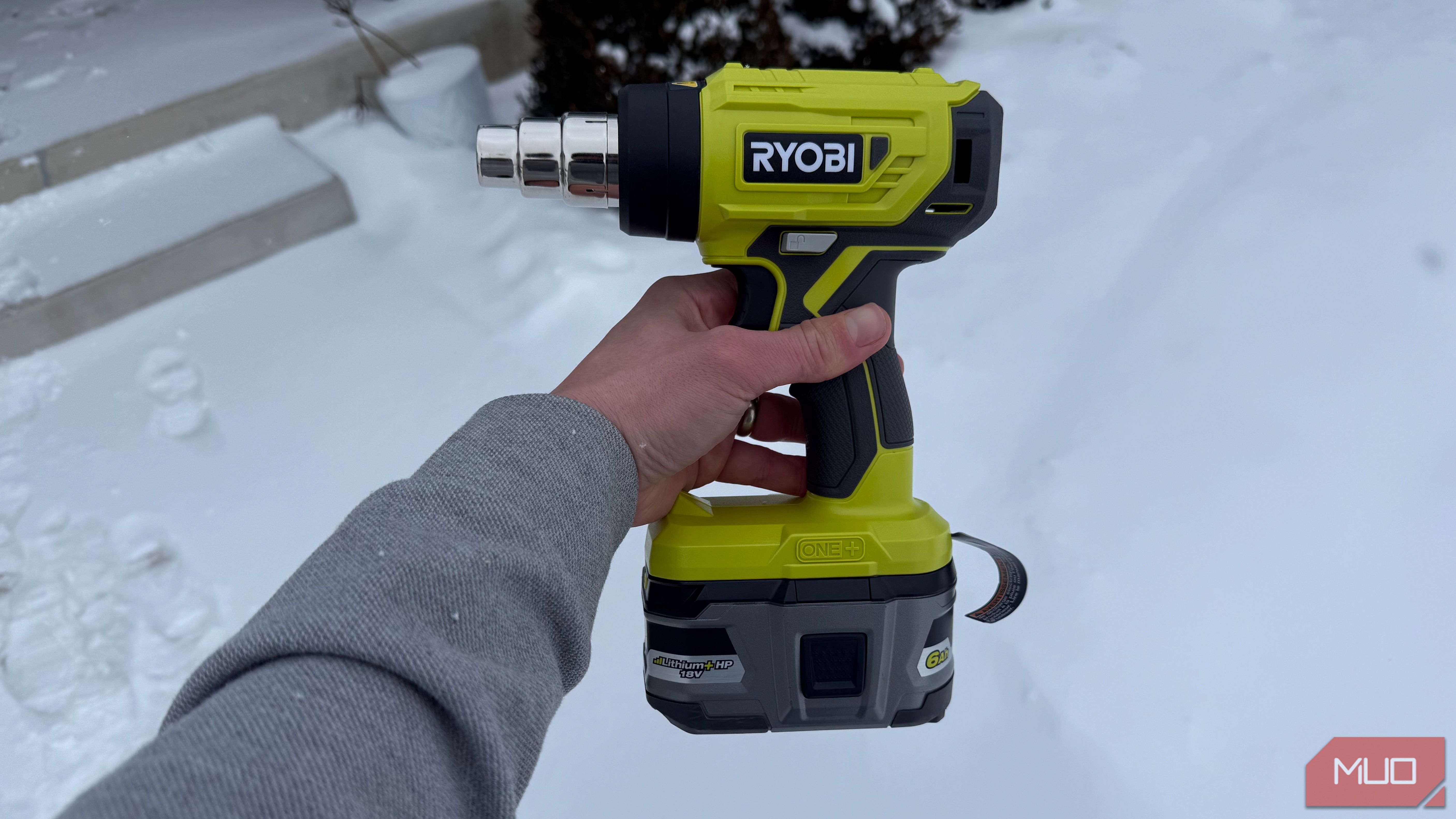 ryobi heat gun left side in hand with snow