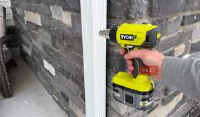 ryobi heat gun pointing at downspout