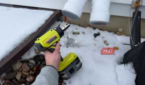 ryobi heat gun pointing at furnace exhaust