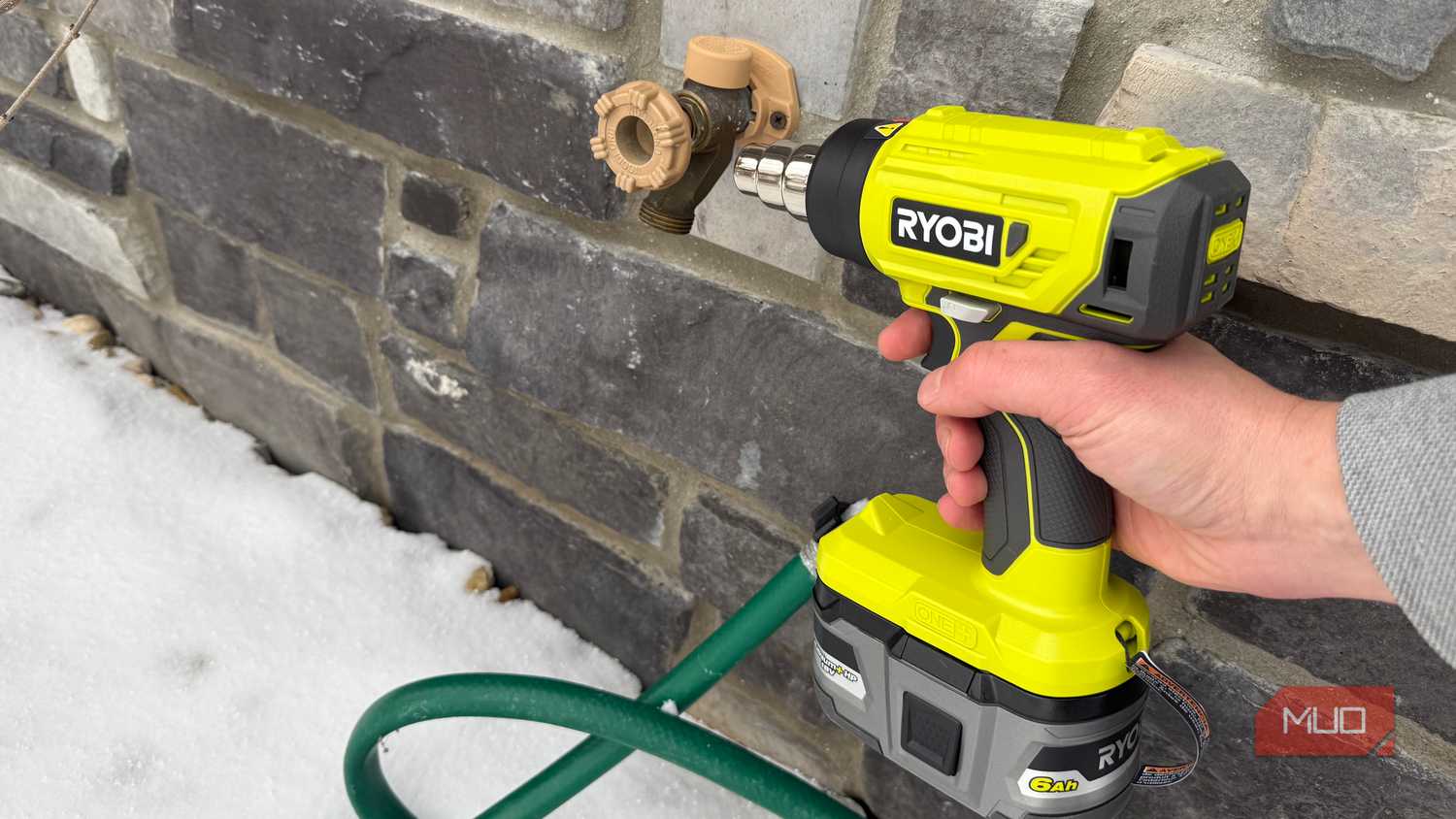 ryobi heat gun pointing at hose bib