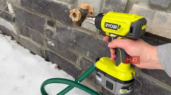ryobi heat gun pointing at hose bib
