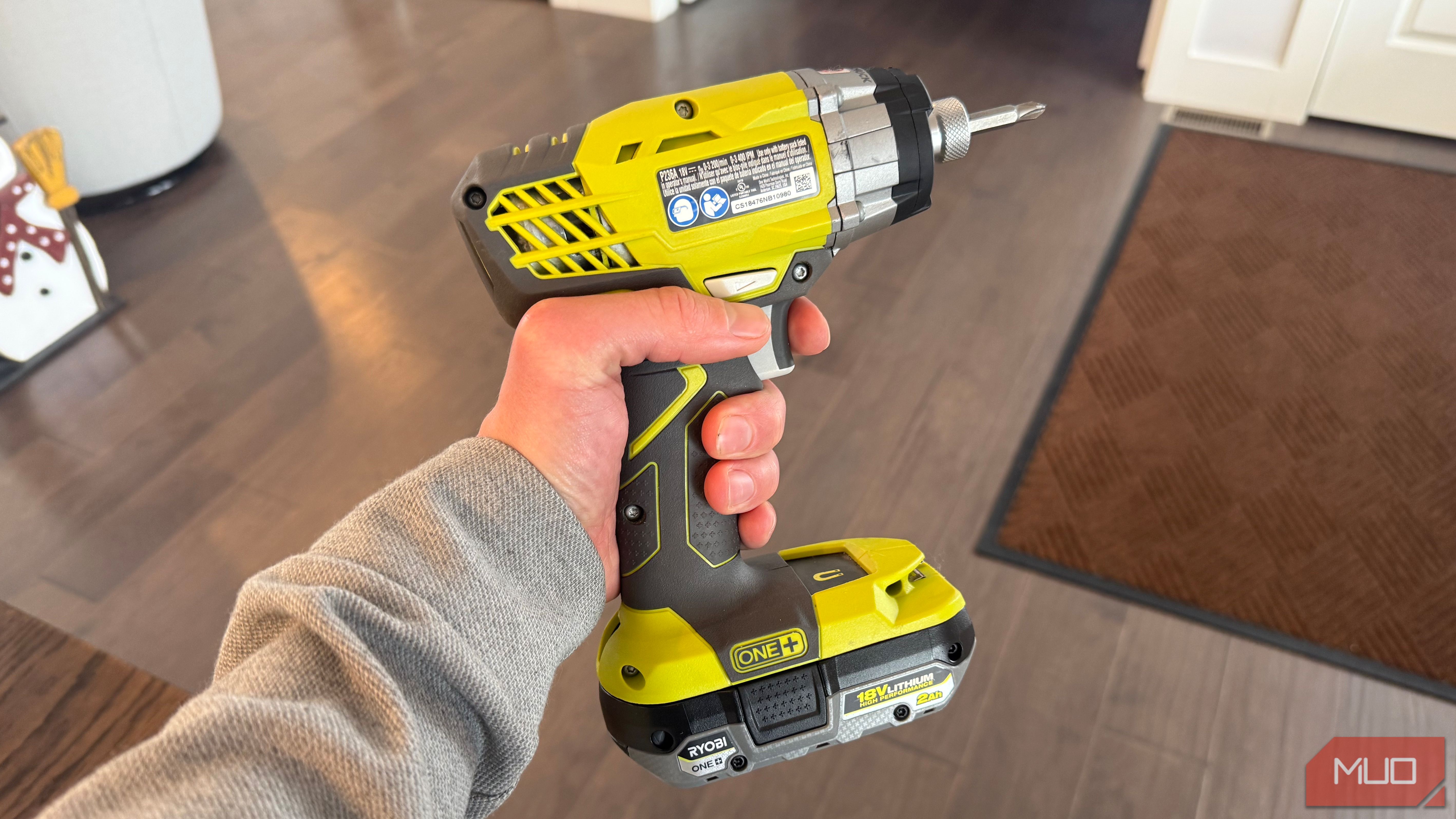 ryobi impact drill with finger on trigger-1