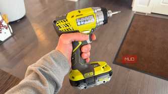 ryobi impact drill with finger on trigger-1