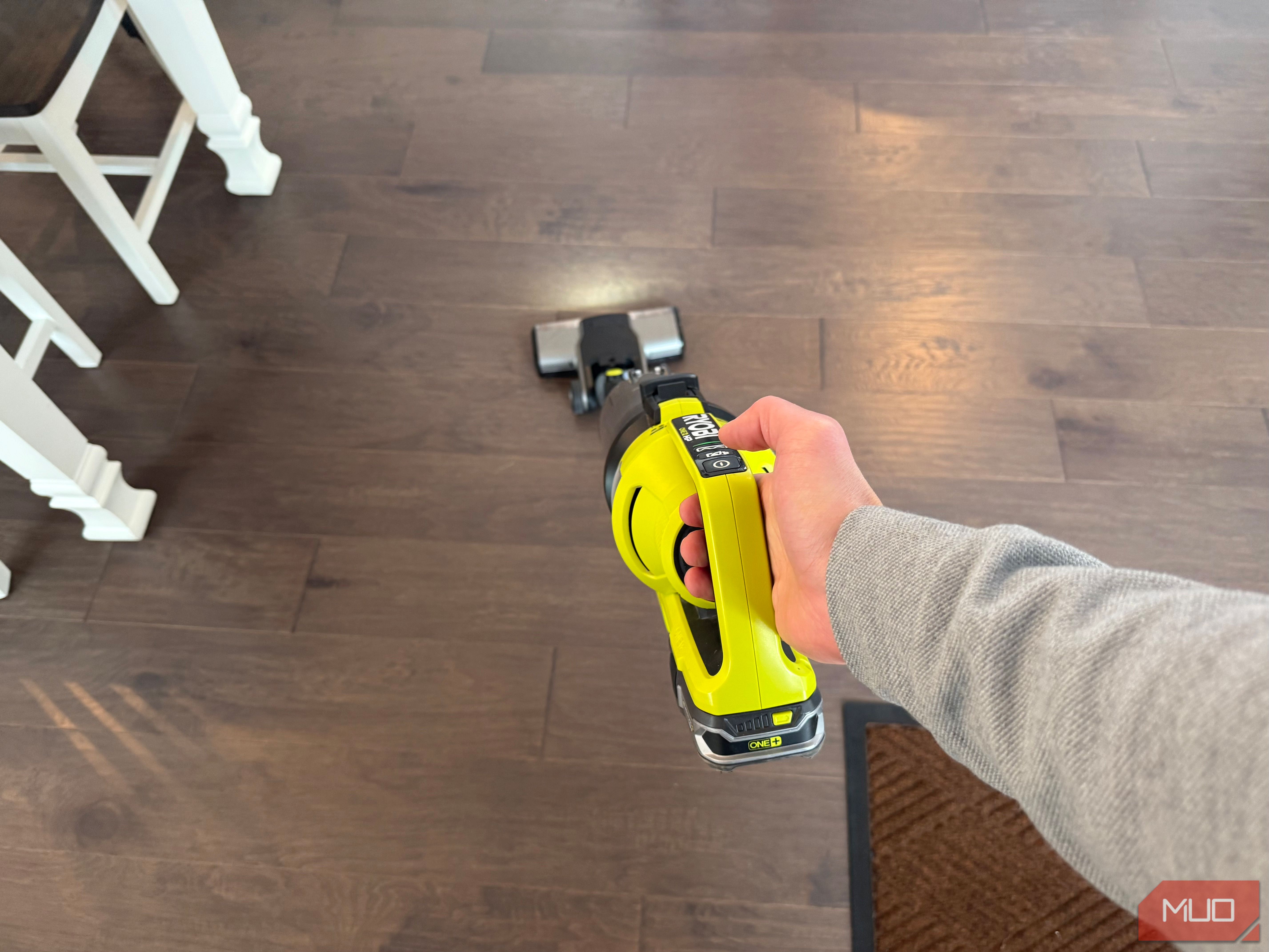 ryobi stick vacuum running in hand