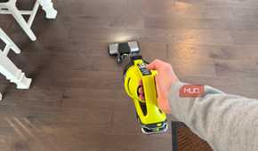ryobi stick vacuum running in hand